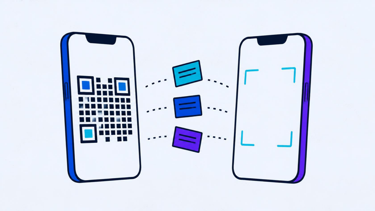 One phone showing a square block code, another aiming a viewfinder at it, cards passing between